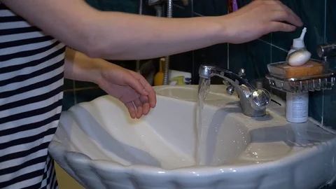 Wash hands with soap with tap water in quarantine Stock Footage