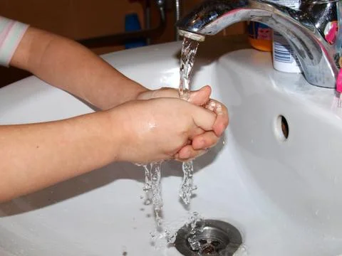 Wash hands with water Stock Photos