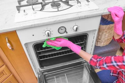 Wash the inside of the oven. Stock Photos