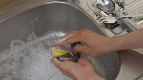 Wash kitchen sink with a sponge Stock Footage 237436485