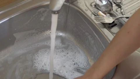 Wash kitchen sink with a sponge slow Stock Footage 237436737