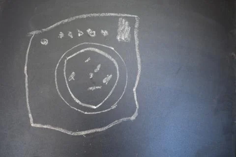 Wash machine on a blackboard Stockfoto's