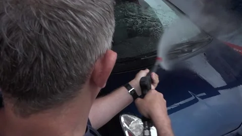 Wash the machine with a high-pressure cleaner Stock Footage 132021542