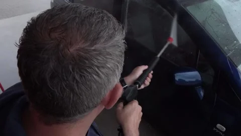 Wash the machine with a high-pressure cleaner Stock Footage 132021550