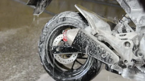 Wash the motorcycle Stock Footage 139321149