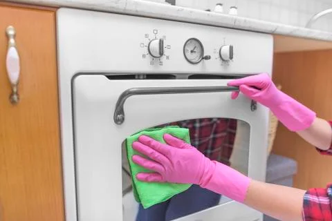 Wash the outside of oven. Stock Photos