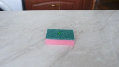 Wash the table with white gloves with a sponge Stock Footage 137329820