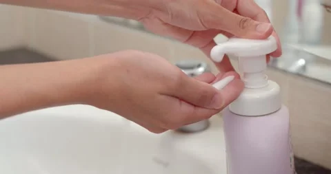 Wash your hands with a foaming hand wash that makes your hands clean and fragran Stock Footage 236457743
