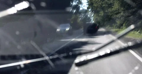 Wash your windshield with wipers and auto-freezer fluid while driving for go Stock Footage 342182675