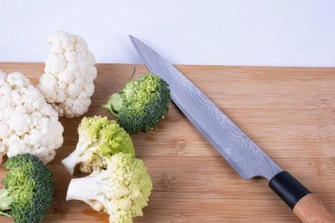 Washed broccoli and cauliflower on a table Stock Photos