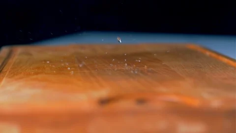 The washed broccoli fall on the cutting board. Slow motion Video stock 105130602