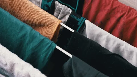 Washed clothes and bed linen are dried on a dryer Stock Footage 312012739