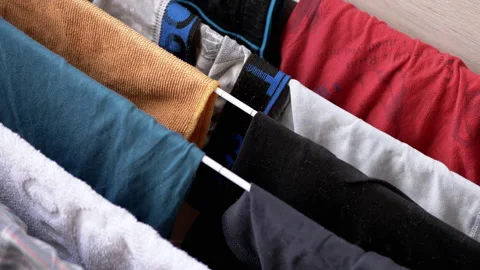 Washed clothes and bed linen are dried on a dryer Stock Footage 312012903
