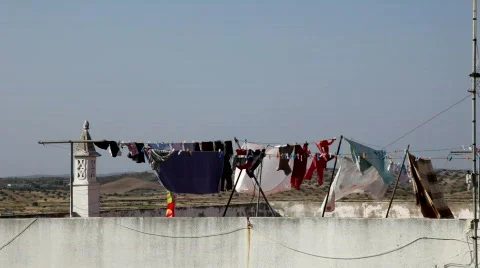 Washed clothes drying in the sun Stock-Footage 771780