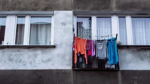 Washed clothes hung out to dry outside the window of a communist style apar.. Stock Photos
