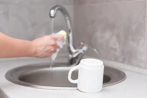 Washed cup on the kitchen table by the sink Stock-Fotos