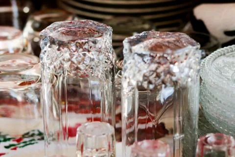 Washed glasses turned upside down and other various dishes Stock Photos