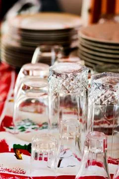 Washed glasses turned upside down and other various dishes Stock Photos