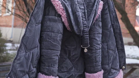 A washed jacket hanging in winter Stock Footage 307530301