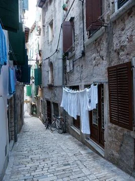 Washed laundry on the facade Stock Photos