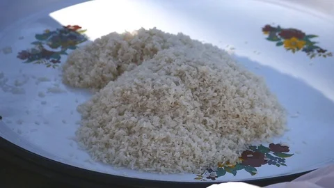 Washed rice in a plate Stock Footage 73561129
