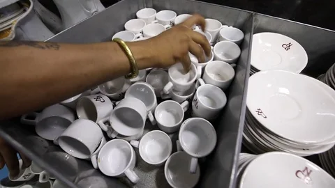 Washed-tea-cups-saucers-at-Indian-Cafe Video stock 76921349