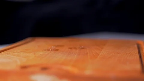 The washed tomatoes fall on the cutting board. Slow motion Stock Footage 105130746