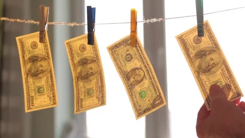 Washed US dollars drying on rope. Video stock 72990287
