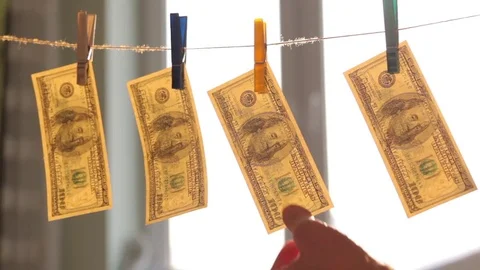 Washed US dollars drying on rope. Stock Footage 72990293