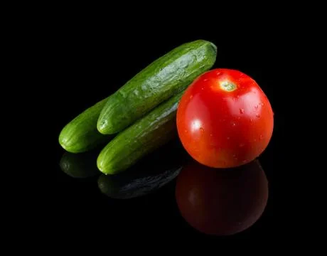 Washed vegetables on black background. Stock Photos