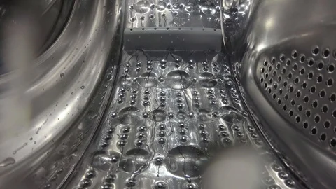 Washer, digital camera inside a rotating perforated drum. Internal view of a  Stock Footage 128954844