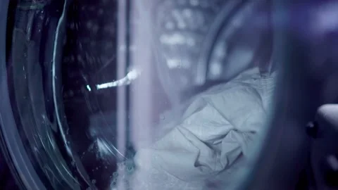 Washer machine running with clothes Stock Footage 305159916