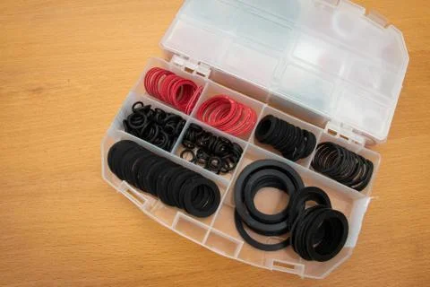 Washers in a box for plumbers Foto stock