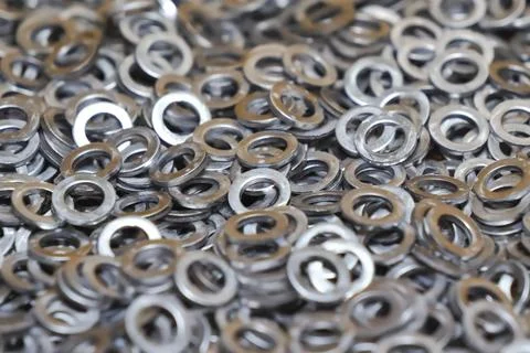 Washers, large quantity, production of, washers for injection packers. Stock Photos