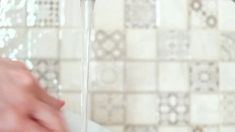 Washes the dishes close-up Stock Footage 137310261