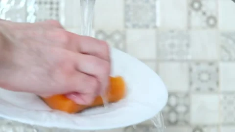 Washes the dishes close-up Stock Footage 137310267