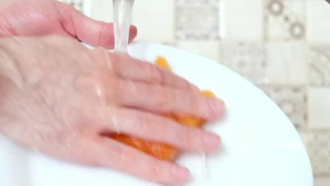 Washes the dishes close-up Stock Footage 137310269