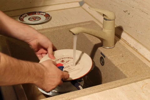 Washes the dishes Stock Footage 49798939