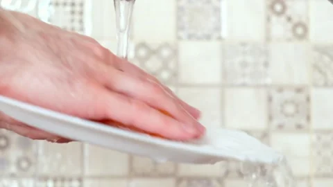 Washes the dishes Stock Footage 137310259