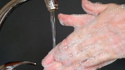 Washes hands with soap under running water Stock Footage 127108024