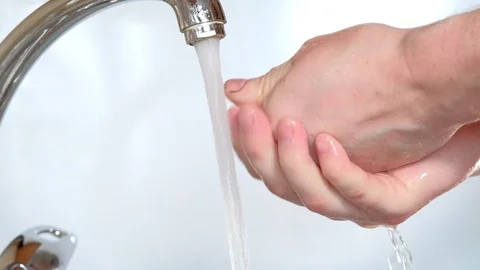 Washes hands with soap under running water Stock Footage 127108103