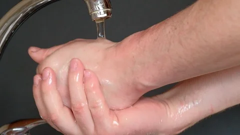 Washes hands with soap under running water Stock Footage 127108116