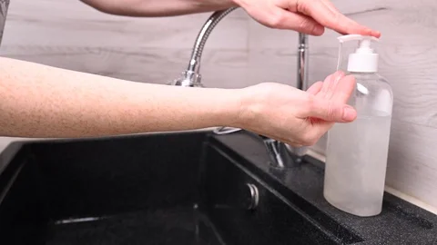 Washes his hands in a sink of soap. protection and disinfection from viruses Stock Footage 130026057