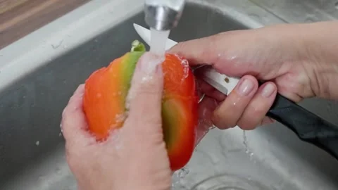 Washing and thoroughly Preparing Fresh, Colorful, and Nutritious Vegetables for Stock Footage 314619010