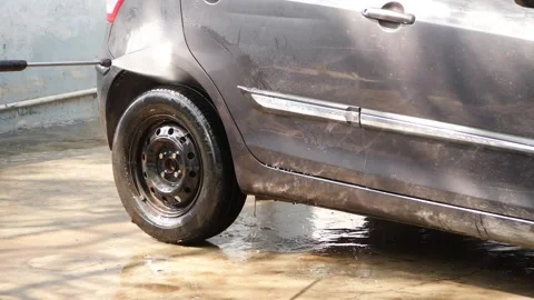 Washing back side of car, Back side  Tyre washing of Tyre Stock Footage 148253286