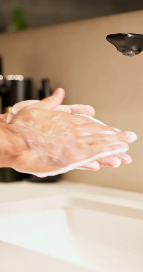 Washing, bathroom and hands of man by sink for cleaning, hygiene and germ Stock Footage 340882890