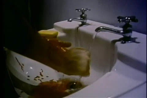 Washing blood off hands in the sink Stock Footage 11353515