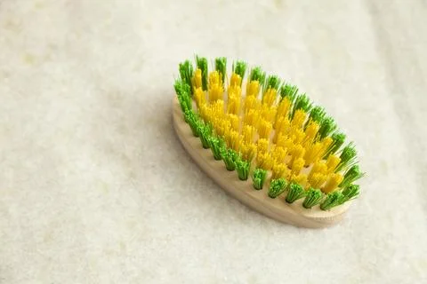 Washing brush on the marble laundry table. Brush used for washing clothes, ac Фото