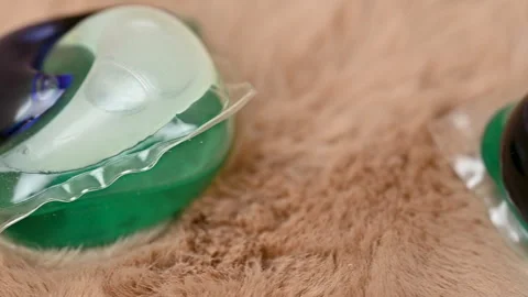Washing capsules on background Stock Footage 283169880