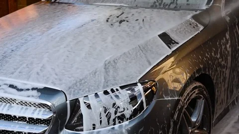 Washing the car with foam Stock Footage 79603485